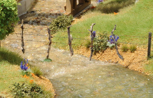 fence over creek